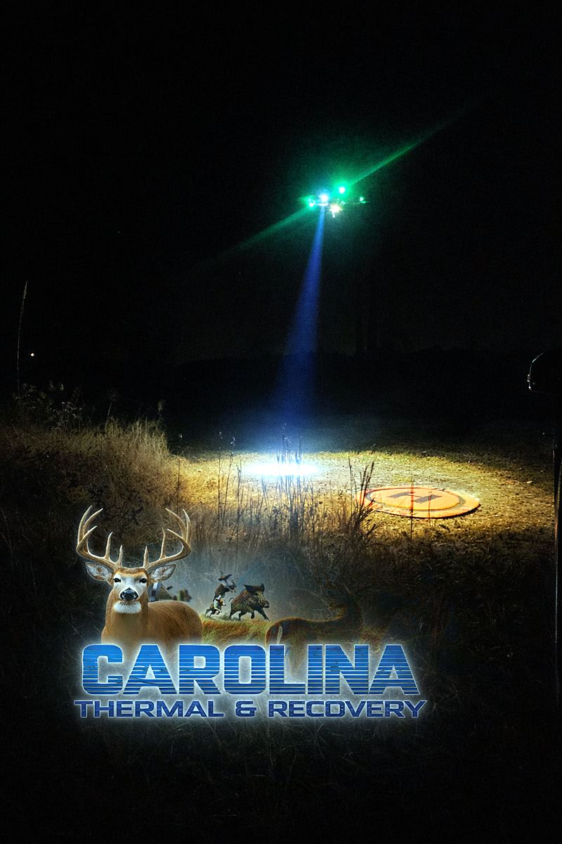 Landing pad lit up in the dark with the drone overhead